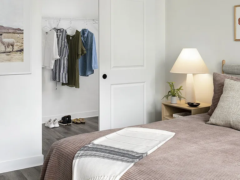 Spacious apartment Bedroom with Large Closet and Wood Floors.