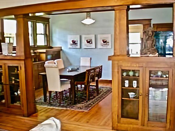 Dining room entrance with original Mission Style quarter-sawn oak 
built-in cabinet room dividers as seen from living room.