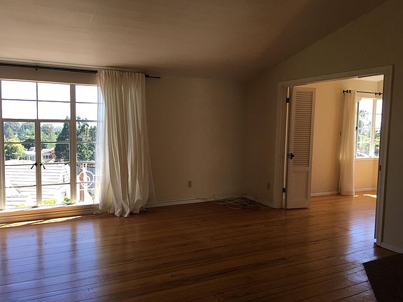 Living room peeking into dining room