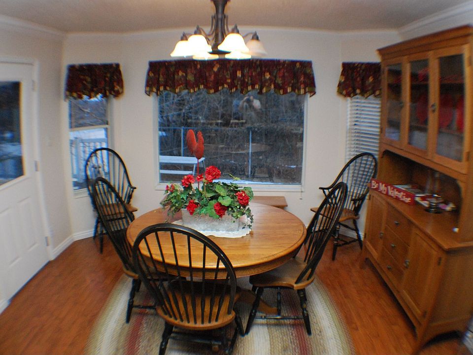 Family dining area; leads onto a shady deck.
