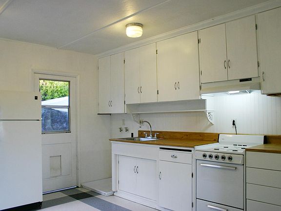 Washer in Kitchen (not shown) there is no dryer but there is a clothesline