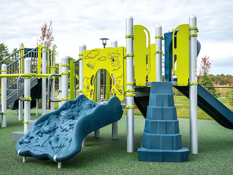 Colorful Children's Playground with Slides and Climbing Wall
