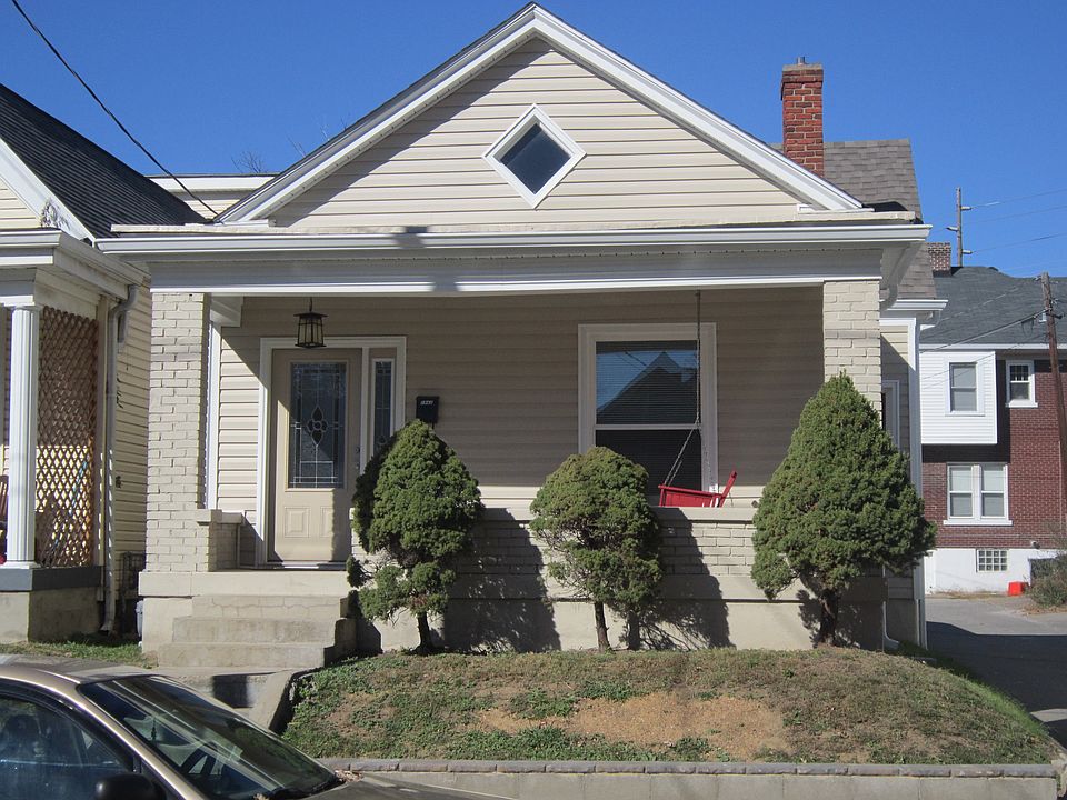 Front of home with new front door and new exterior vinyl sid