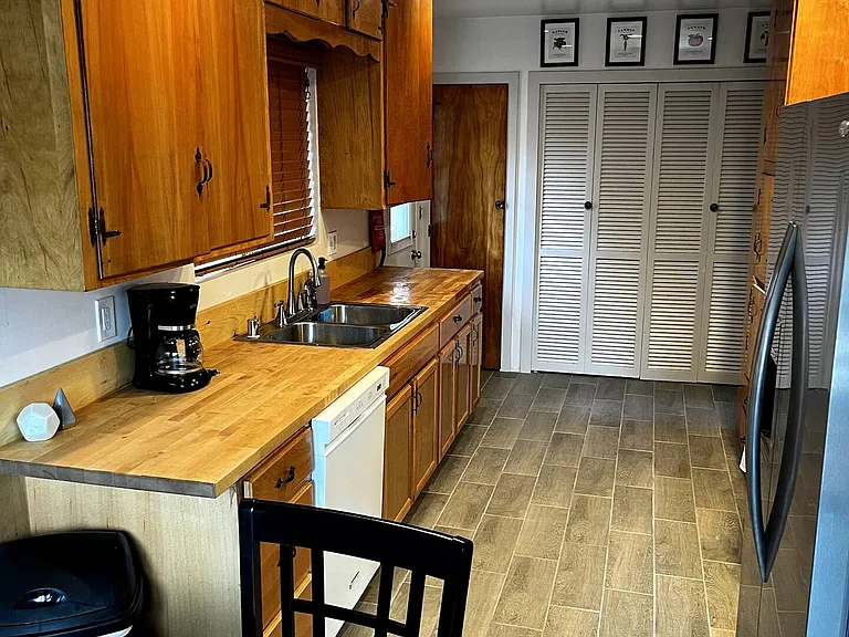 Living room with Laundry area.