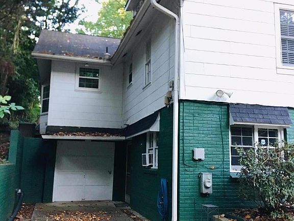 Entrance to the right of the garage door.