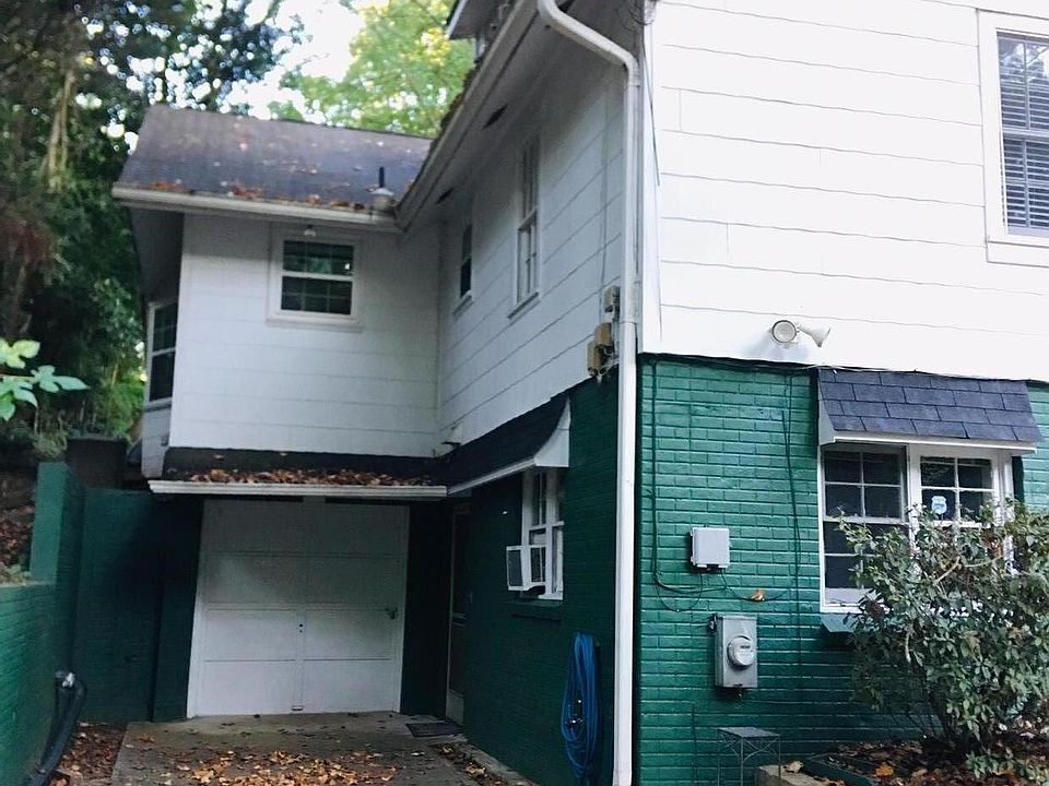 Entrance to the right of the garage door.