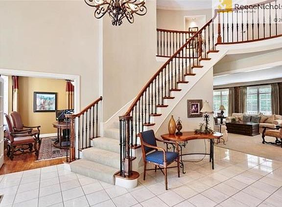 Open entry flows seamlessly into the home office, formal sitting room, or formal dining room.