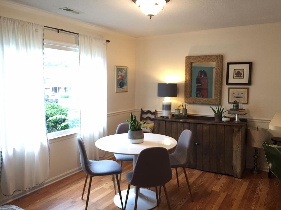 Front room with oversized window (seen furnished but not included)