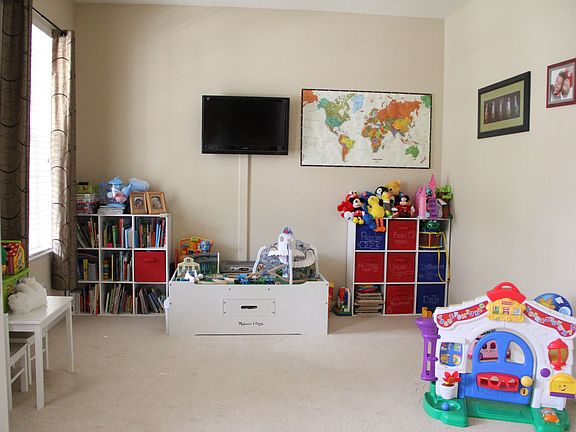 French doors lead into a den or playroom