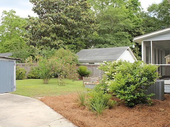 Fenced-in back yard, with plenty of room for BBQs and playin