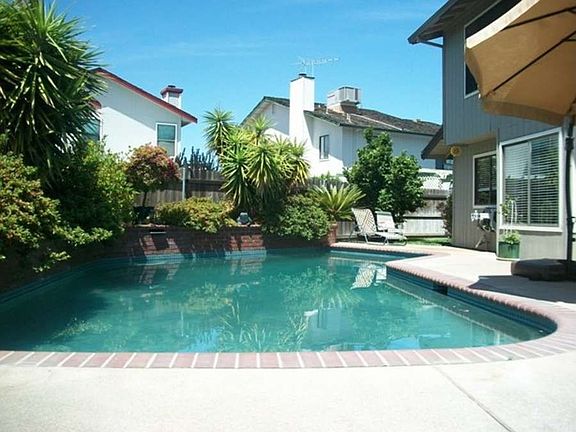 "Enjoy this summer in the Tahoe blue bottom pool with two water features.."