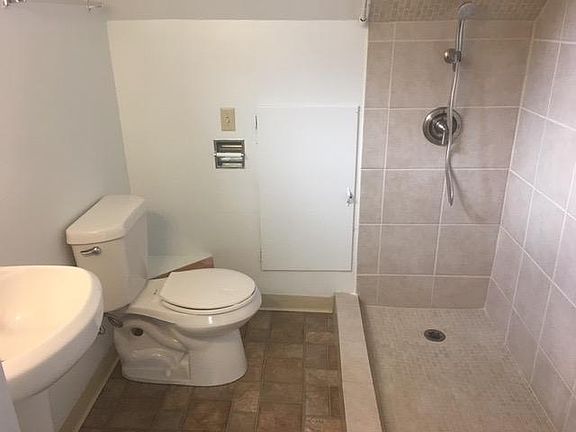 bathroom with tile shower