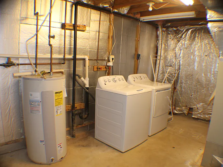 UTILTY ROOM WITH WASHER DRYER IN BASEMENT
