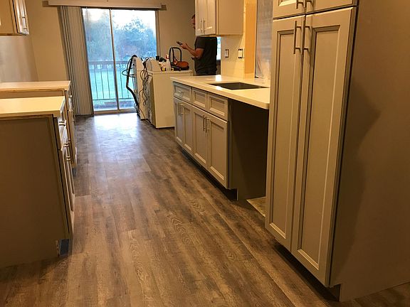 Overview of kitchen looking out on fairway