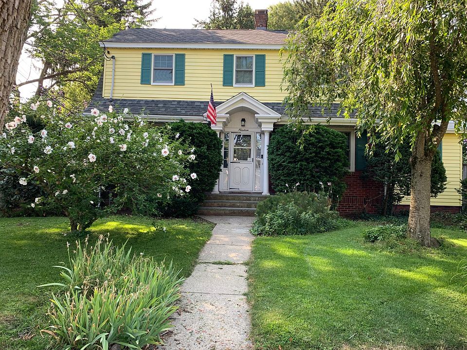 View from the street, a delightfully renovated 4 bedroom house with a large fenced-in backyard, close to I90/I95/T/commuter rail/downtown bus.