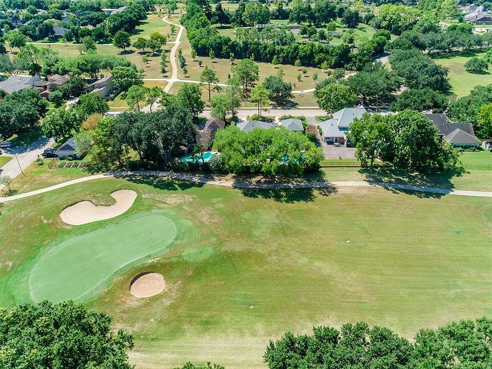 View of the lovely golf course that is nestled in this quiet neighborhood