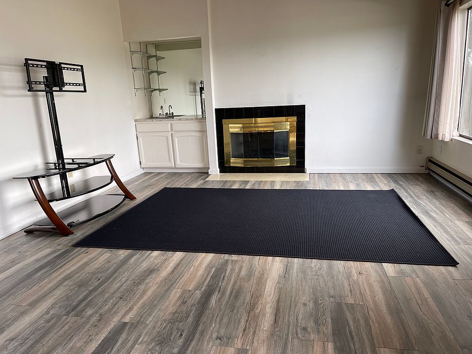 Living room with a wet bar and a fireplace