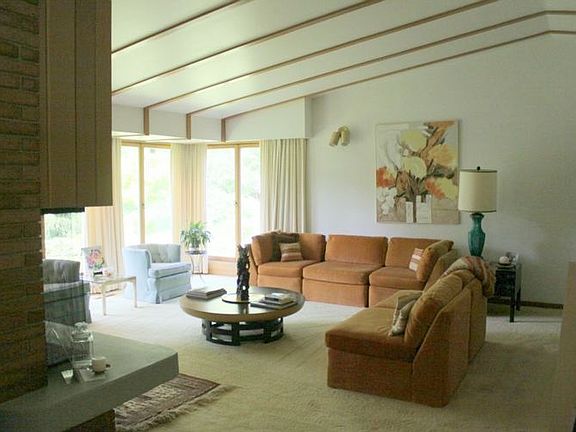 Comfort meets style in this open living space.  The living room flows easily into the dining room and continues into a wonderful family room.   