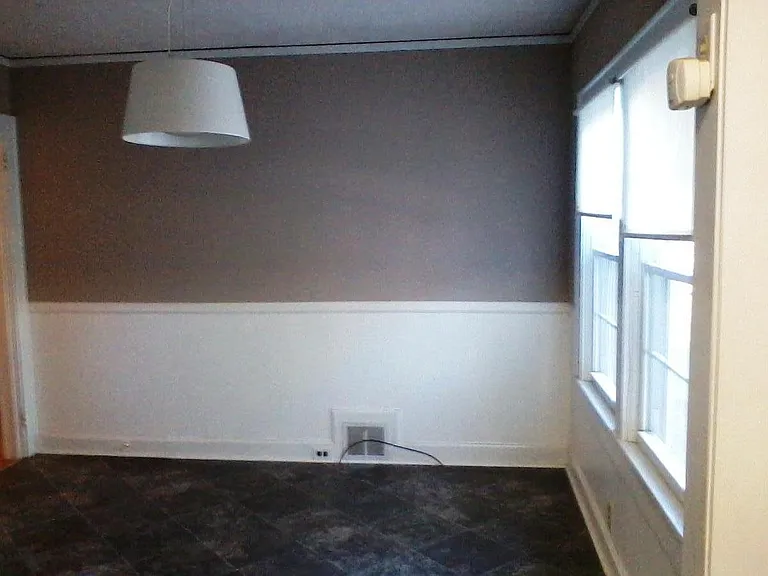Huge sunny breakfast area across from kitchen cabinets