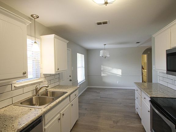 Kitchen with new sink, range and granite counter tops