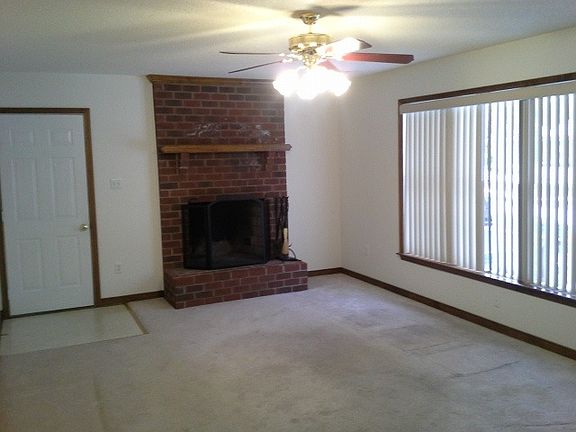 Large Living room with ceiling fan, wood burning fireplace l