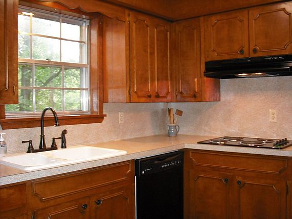 Kitchen with new countertops, sink, range, dishwasher