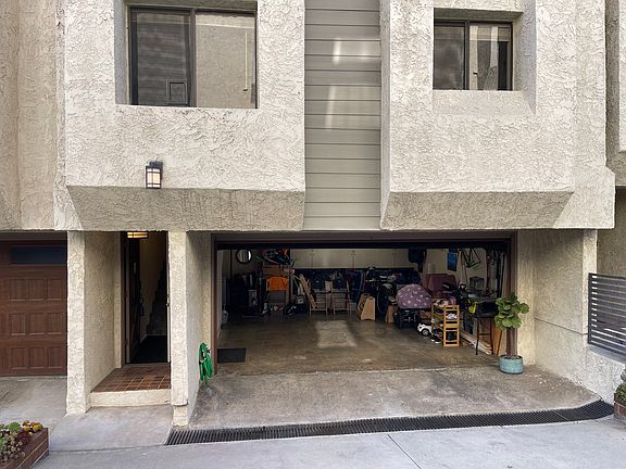 Park and walk right in (no parking wars outside). Although, parking in area is generally good. Storage cabinets, washer and gas dryer in garage.