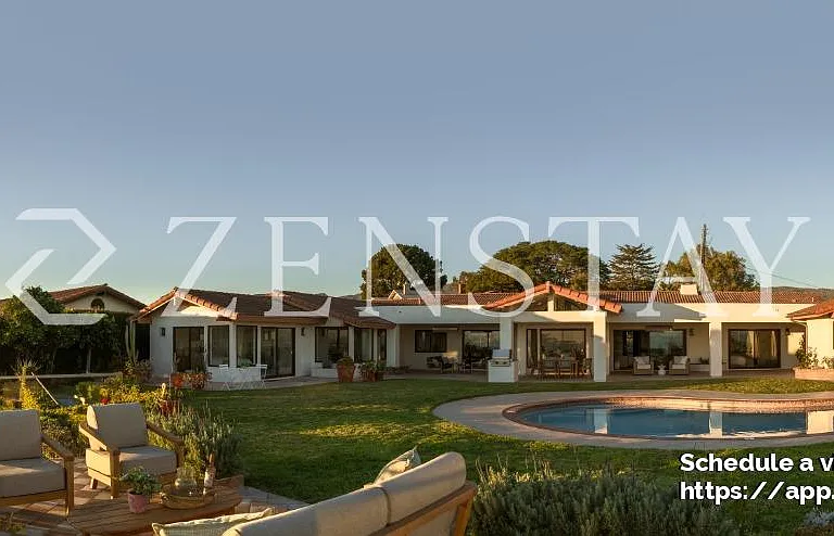 Single-story estate with classic tile roof and expansive frontage