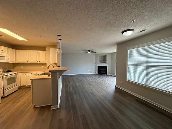 Dining area, kitchen, and LR