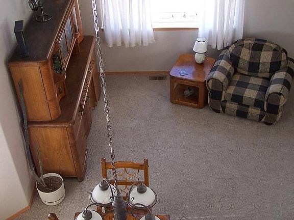 Look down onto the family activity in the formal living room and dining room.