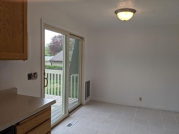 Eat in kitchen area w sliding glass & dog door to private deck and back yard!