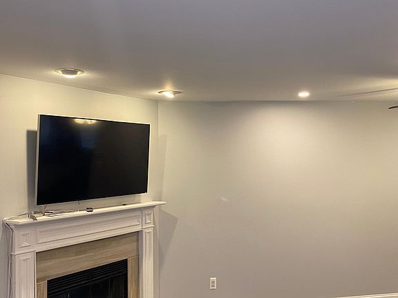 Main living area with wood-burning fireplace.