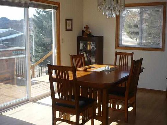 Lighted dining room that leads to the deck