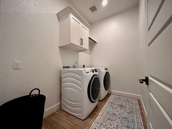 Laundry Room with GE washer & dryer (less than 2 years old)