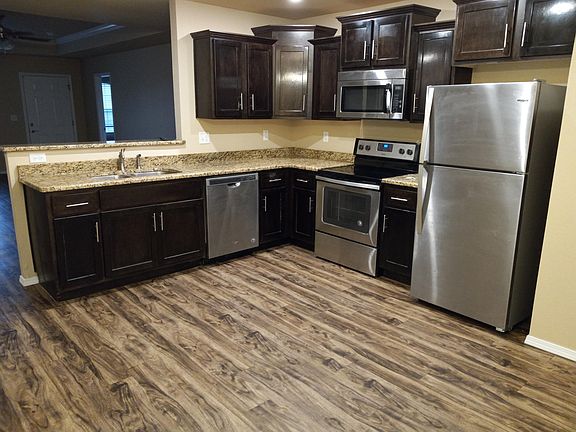 Kitchen area with Stainless Steel appliances and Granite Countertops!