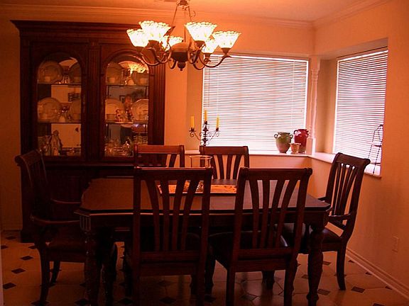 ENTER THE FORMAL DINING ROOM FROM THE LIVING AREA OR KITCHEN.  THIS ROOM HAS CORNER WINDOWS.  GREAT AREA FOR DECORATING OR SERVING.  TILE FLOORS.