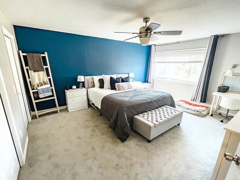 Primary bedroom. Room for king size bed, end tables, dresser, vanity - all of your furniture needs!