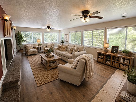 Sunken living room with natural light everywhere. 

Images are virtually staged using AI to showcase the home's potential. Actual layout and finishes are accurate; furnishings are not included.