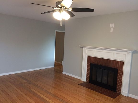 Beautiful Living Room with Large Windows, Ceiling Fan, Hardw
