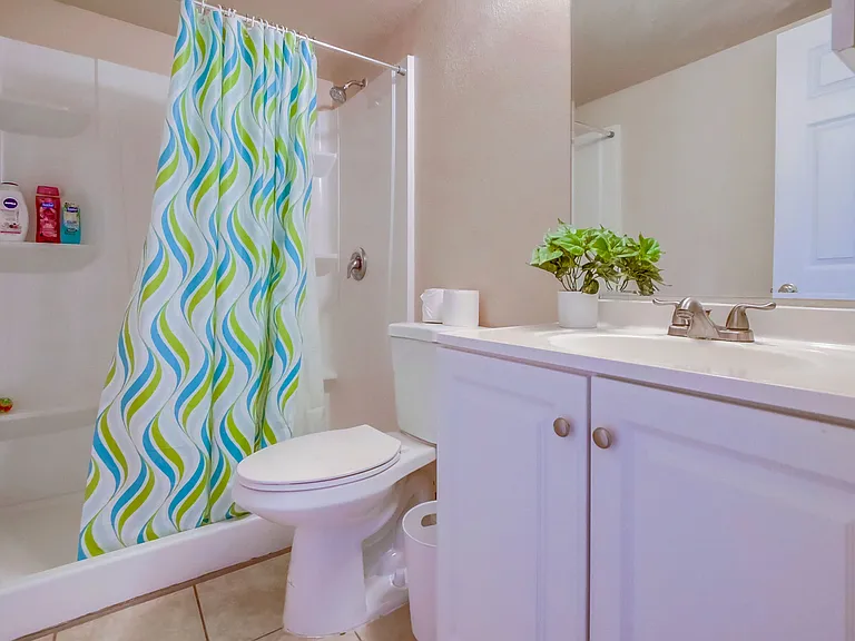 Refresh in a bathroom featuring a convenient walk-in shower.