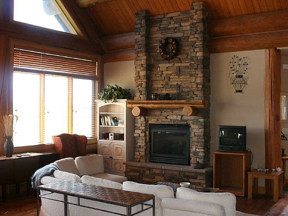 Great Room with Floor-to-ceiling Stone Fireplace