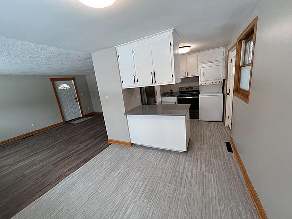 The view from the dining room, which flows into the kitchen and living room.