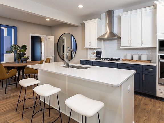 Island kitchen and adjoining breakfast area at a DRB Homes Clemson model at the Huntfield community.