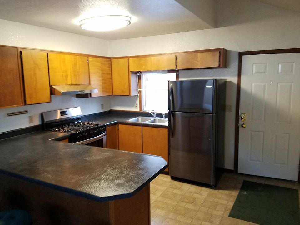 Kitchen from Living area looking towards front door
