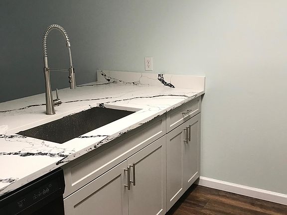 Granite counter top, large kitchen sink and dishwasher