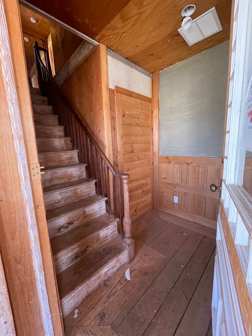  Apartment Entry: Bottom of Stairs