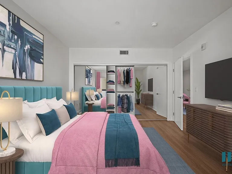 Spacious Bedroom with a Mirrored CLoset with Shelving, Vinyl Flooring, and Recessed Lighting