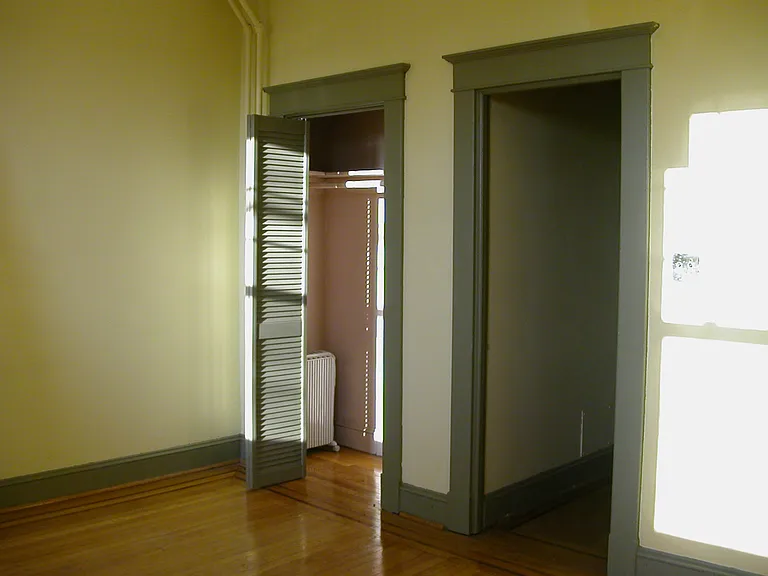 Large bedroom closet (left) and entry to hall (right).