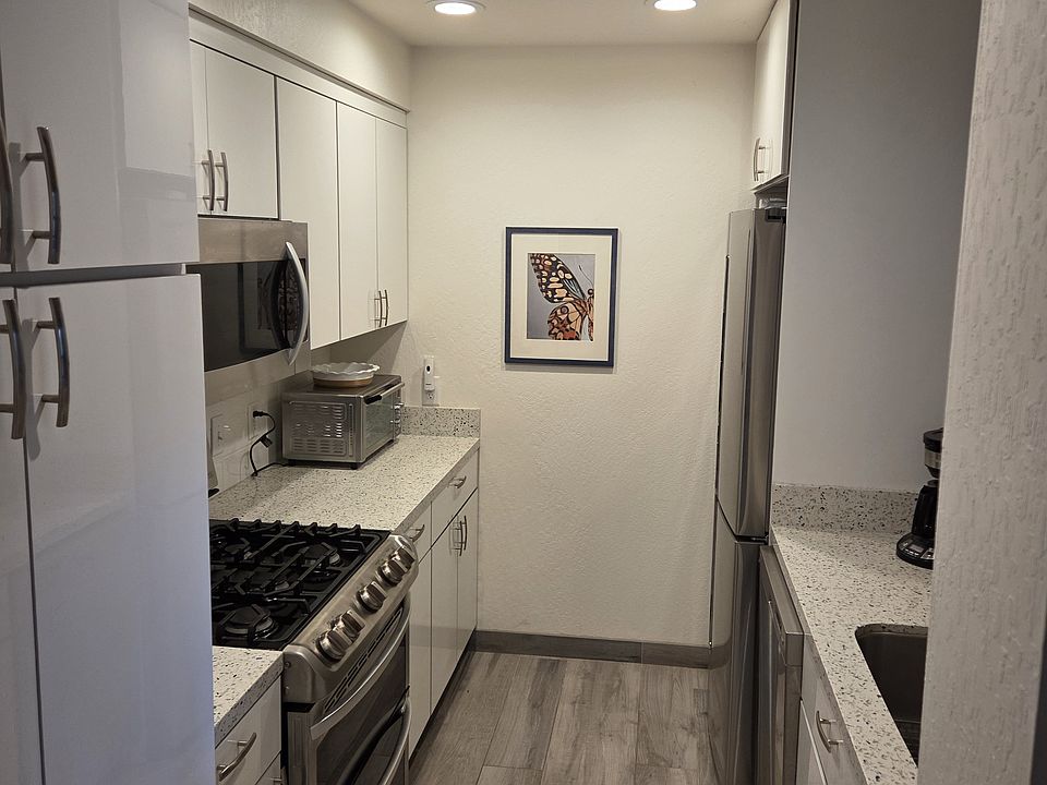 Kitchen with stainless appliances and gas stove