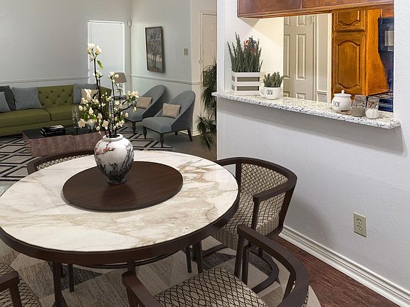 Open concept living and dining room with granite counter tops